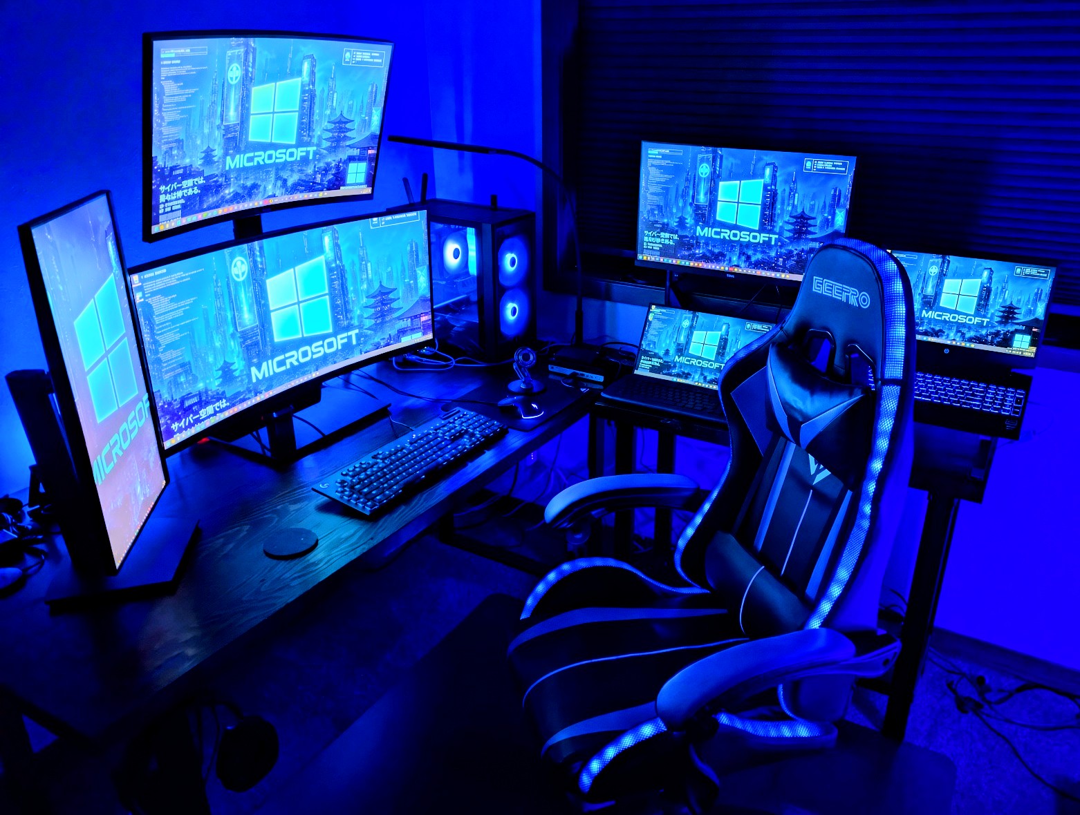 Evan's home workstation: two monitors and a desktop PC under red lighting
